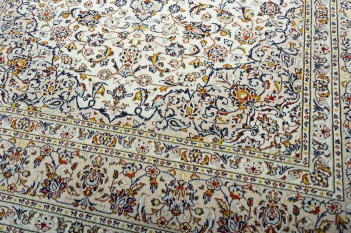 Close-up detail of 2000s Kashan rug from Iran / Persia showing Wool weave