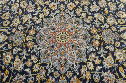 Central medallion detail of 2000s Kashan rug from Iran / Persia