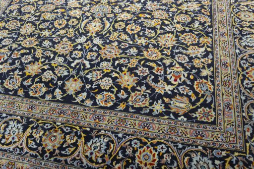 Close-up detail of 2000s Kashan rug from Iran / Persia showing Wool weave