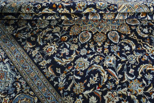 Close-up detail of 2000s Kashan rug from Iran / Persia showing Wool weave