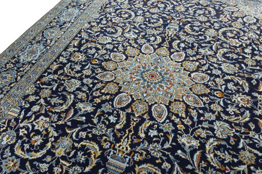 Backside of handmade 2000s Kashan rug showing knot structure and weave density