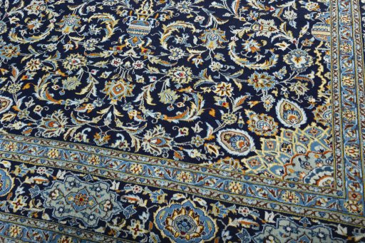 Close-up detail of 2000s Kashan rug from Iran / Persia showing Wool weave