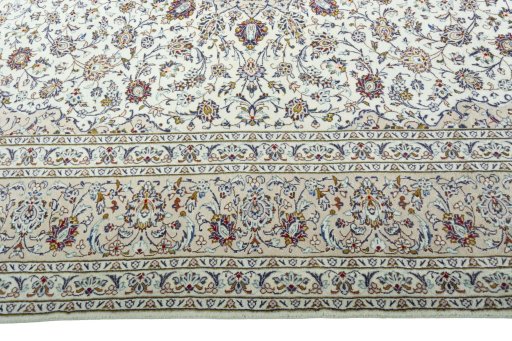 Corner detail of 2000s Kashan rug showing border pattern and Wool pile