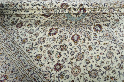 Close-up detail of 2000s Kashan rug from Iran / Persia showing Wool weave