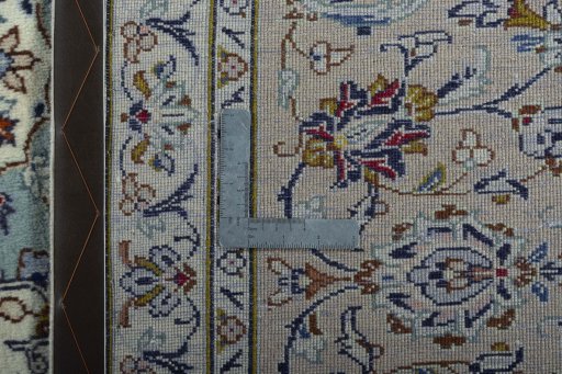 Backside of handmade 2000s Kashan rug showing knot structure and weave density