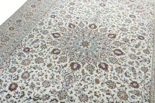 Backside of handmade 2000s Kashan rug showing knot structure and weave density