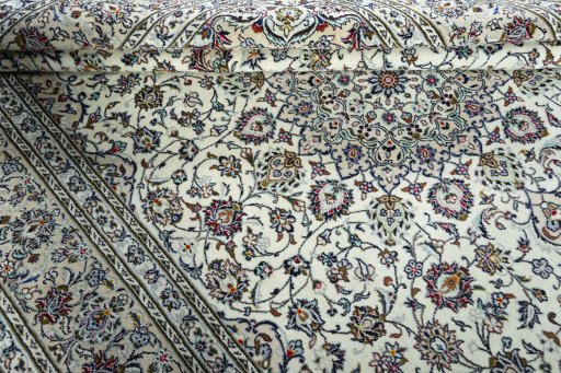 Close-up detail of 2000s Kashan rug from Iran / Persia showing Wool weave