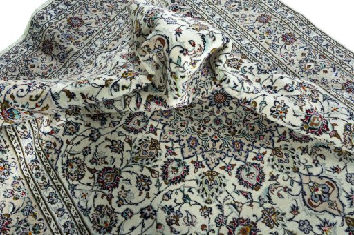 Surface texture of 2000s Kashan rug with natural Wool and intricate pattern