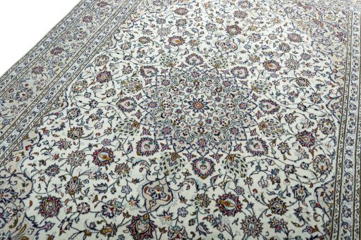 Backside of handmade 2000s Kashan rug showing knot structure and weave density