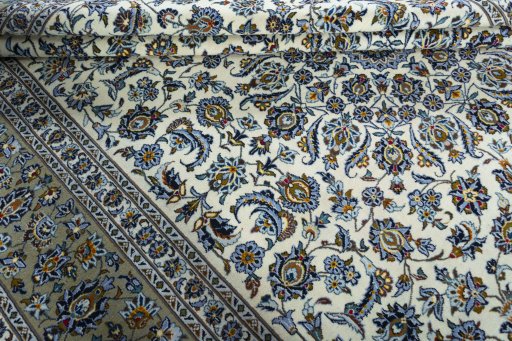 Close-up detail of 2000s Kashan rug from Iran / Persia showing Wool weave