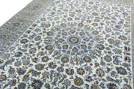 Backside of handmade 2000s Kashan rug showing knot structure and weave density