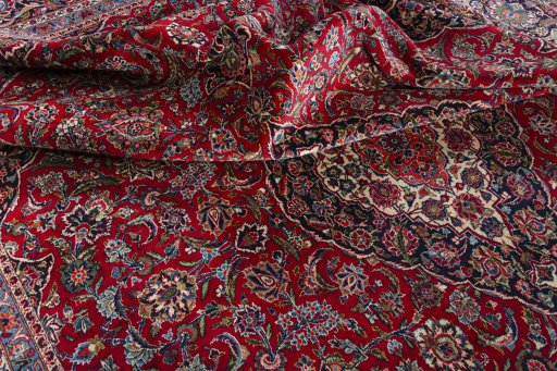 Surface texture of 1950s Kashan rug with natural Wool and intricate pattern