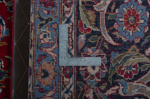Backside of handmade 1950s Kashan rug showing knot structure and weave density