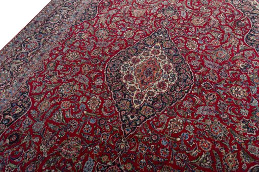 Backside of handmade 1950s Kashan rug showing knot structure and weave density