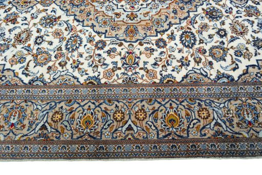 Corner detail of 2000s Kashan rug showing border pattern and Wool pile