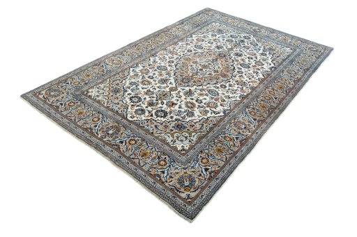 Corner detail of 2000s Kashan rug showing border pattern and Wool pile
