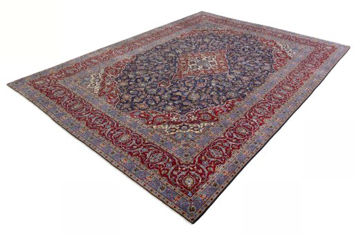Corner detail of 2000s Kashan rug showing border pattern and Cork pile