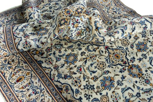 Surface texture of 2000s Kashan rug with natural Wool and intricate pattern