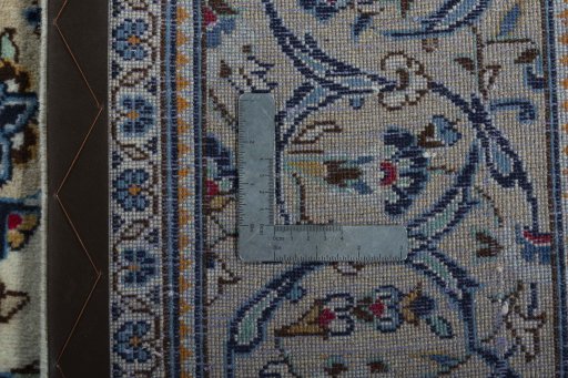 Backside of handmade 2000s Kashan rug showing knot structure and weave density