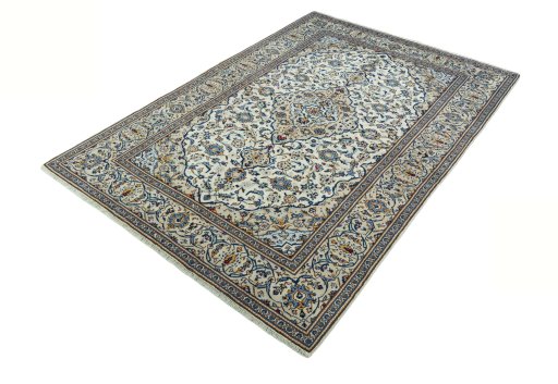 Corner detail of 2000s Kashan rug showing border pattern and Wool pile