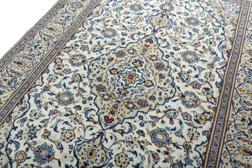 Backside of handmade 2000s Kashan rug showing knot structure and weave density