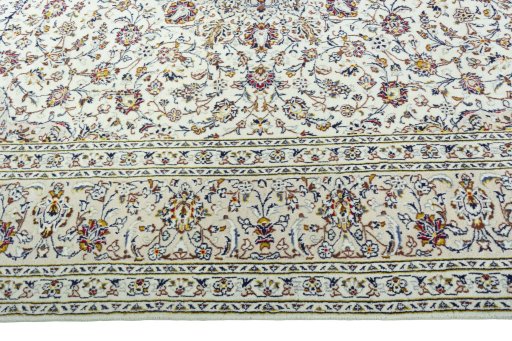Corner detail of 2000s Kashan rug showing border pattern and Wool pile
