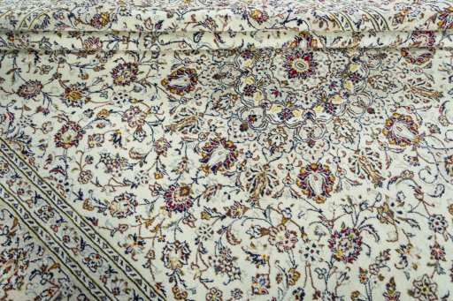 Close-up detail of 2000s Kashan rug from Iran / Persia showing Wool weave