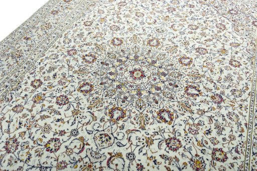 Backside of handmade 2000s Kashan rug showing knot structure and weave density