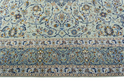 Corner detail of 2000s Kashan rug showing border pattern and Wool pile
