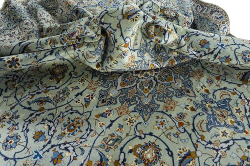 Surface texture of 2000s Kashan rug with natural Wool and intricate pattern
