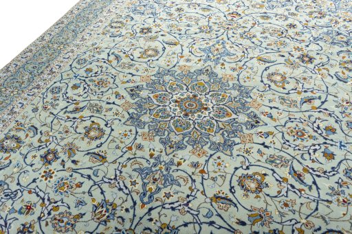 Backside of handmade 2000s Kashan rug showing knot structure and weave density