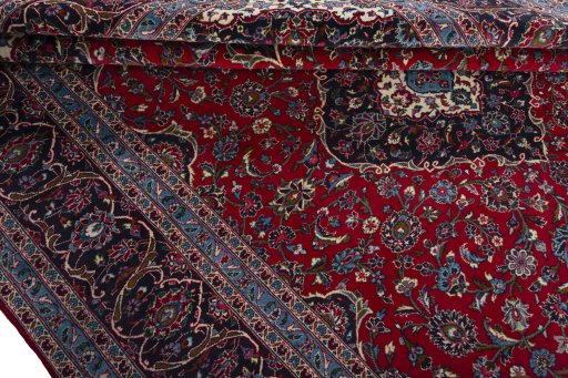 Close-up detail of 2000s Kashan rug from Iran / Persia showing Wool weave