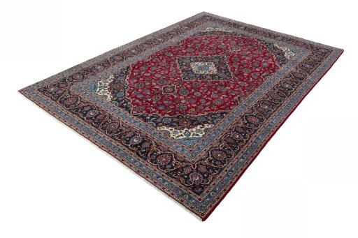 Corner detail of 2000s Kashan rug showing border pattern and Wool pile
