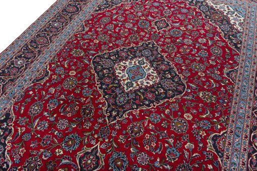 Backside of handmade 2000s Kashan rug showing knot structure and weave density