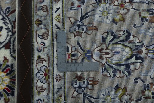 Backside of handmade 2000s Kashan rug showing knot structure and weave density