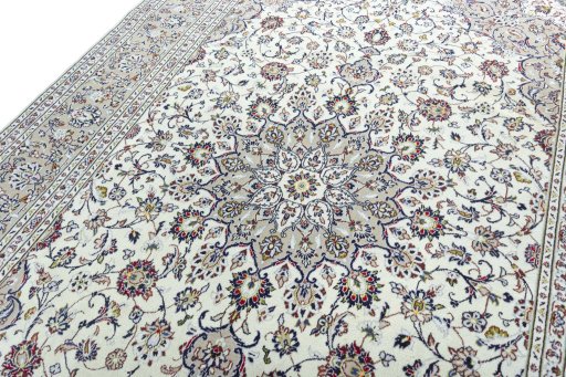 Backside of handmade 2000s Kashan rug showing knot structure and weave density
