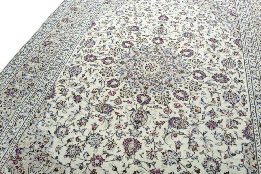 Backside of handmade 2000s Kashan rug showing knot structure and weave density