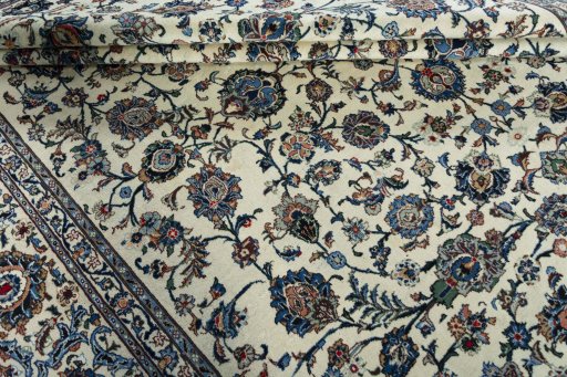 Close-up detail of 2000s Kashan rug from Iran / Persia showing Wool weave