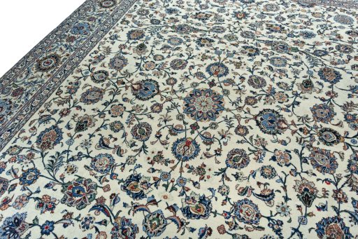 Backside of handmade 2000s Kashan rug showing knot structure and weave density