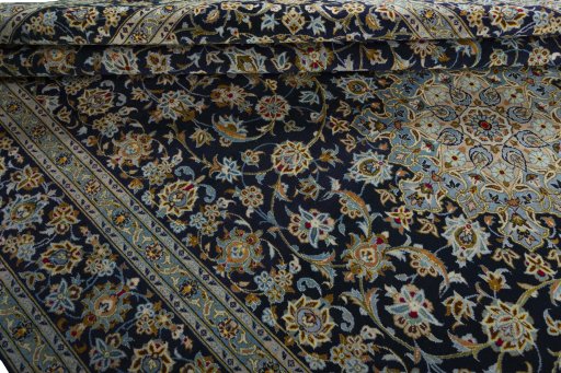 Close-up detail of 2000s Kashan rug from Iran / Persia showing Wool weave