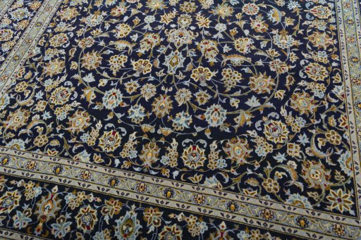Close-up detail of 2000s Kashan rug from Iran / Persia showing Wool weave