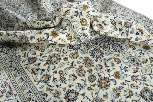 Surface texture of 2000s Kashan rug with natural Wool and intricate pattern