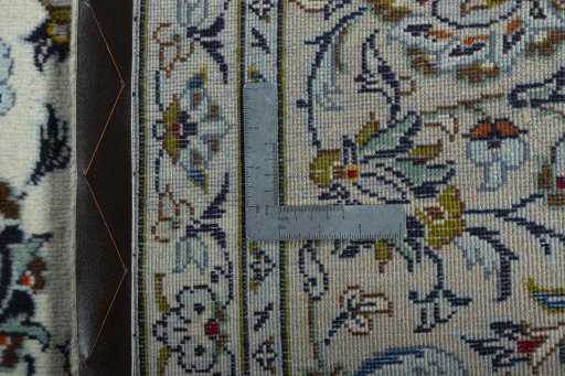 Backside of handmade 2000s Kashan rug showing knot structure and weave density
