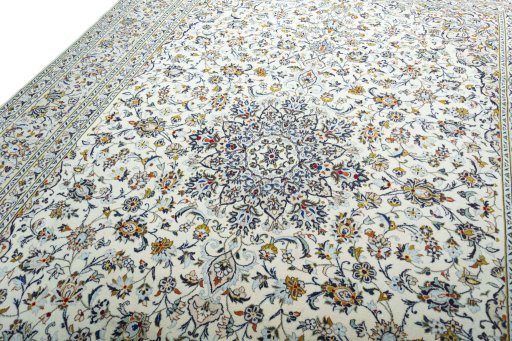 Backside of handmade 2000s Kashan rug showing knot structure and weave density