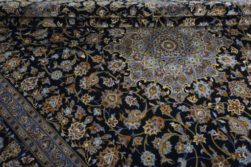 Close-up detail of 2000s Kashan rug from Iran / Persia showing Wool weave