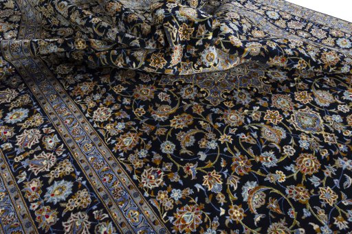 Surface texture of 2000s Kashan rug with natural Wool and intricate pattern