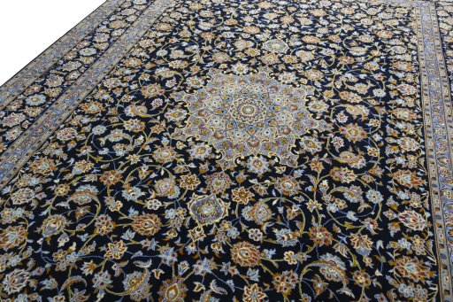 Backside of handmade 2000s Kashan rug showing knot structure and weave density