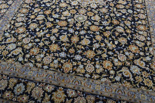 Close-up detail of 2000s Kashan rug from Iran / Persia showing Wool weave