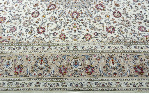 Corner detail of 2000s Kashan rug showing border pattern and Wool pile
