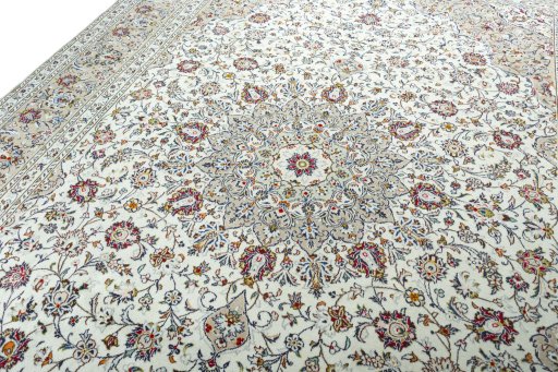 Backside of handmade 2000s Kashan rug showing knot structure and weave density